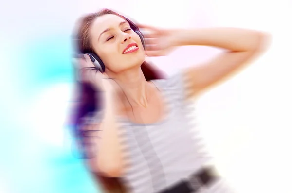 View of young female listening music via earphones. Image may contain slight multicolor aberration as a part of design. — Stock Photo, Image