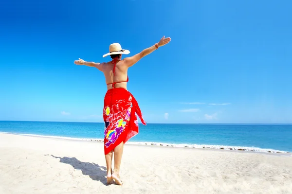 View of female back on a background of the tropical sea — Stock Photo, Image