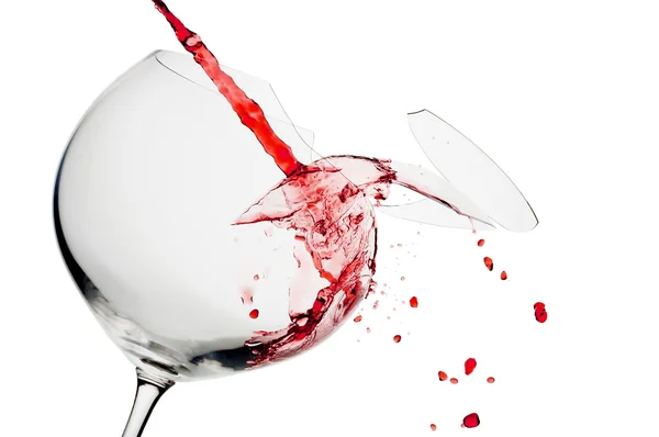 View of broken wine glass getting filled with red wine — Stock Photo, Image