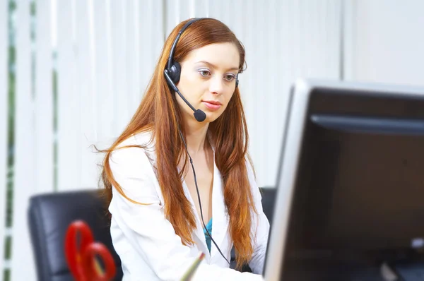 View of nice operator in stylish glasses at her working place — Stock Photo, Image