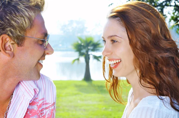 Portrait of attractive couple having date on the beach — Stock Photo, Image