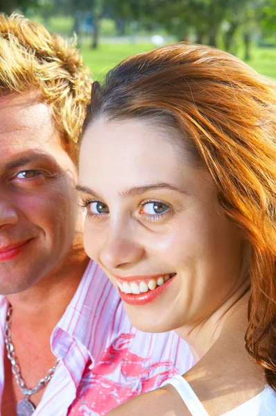 A portrait of attractive couple in summer environment — Stock Photo, Image