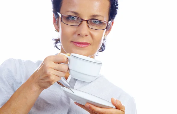 Portrait of businesswoman drinking coffee in office environment — Stock Photo, Image