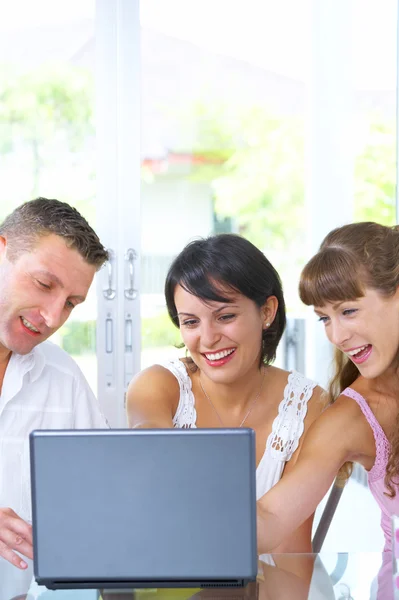 Portrait of a group of young with computer — Stock Photo, Image