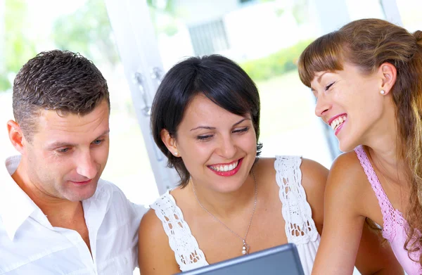 Portrait of a group of young with computer — Stock Photo, Image