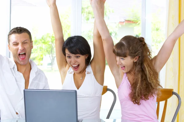 Portrait of a group of young with computer — Stock Photo, Image