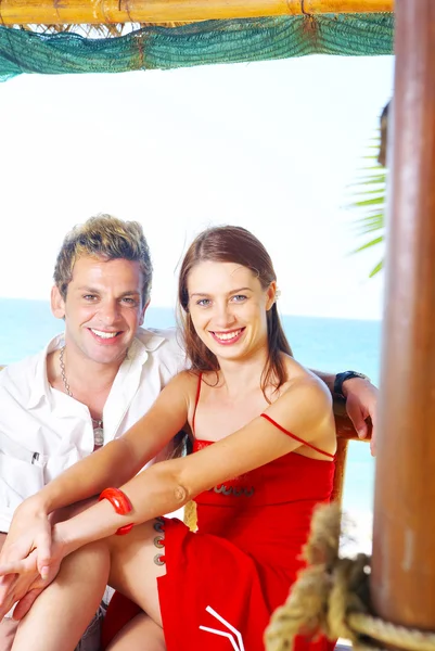 Portrait of attractive couple having date on the beach — Stock Photo, Image