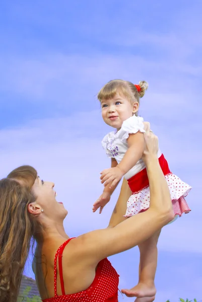 Portrait of young happy mother holding her baby — Stock Photo, Image