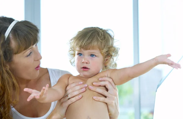 High key portrait of happy mother with baby — Stock Photo, Image