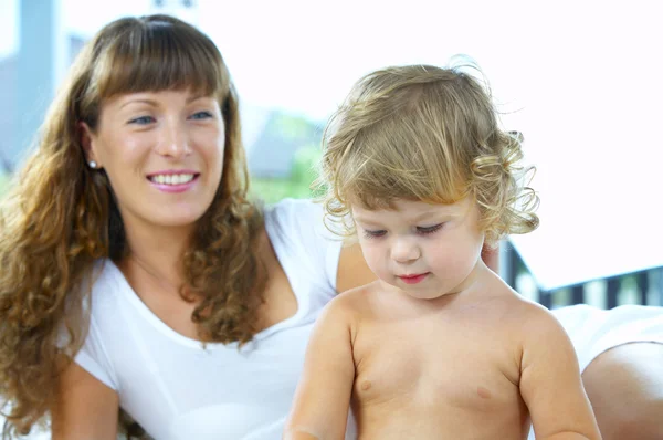 High key portrait of happy mother with baby — Stock Photo, Image