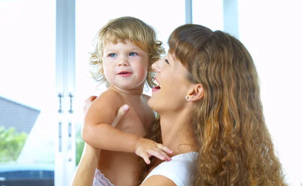 High key portrait of happy mother with baby — Stock Photo, Image