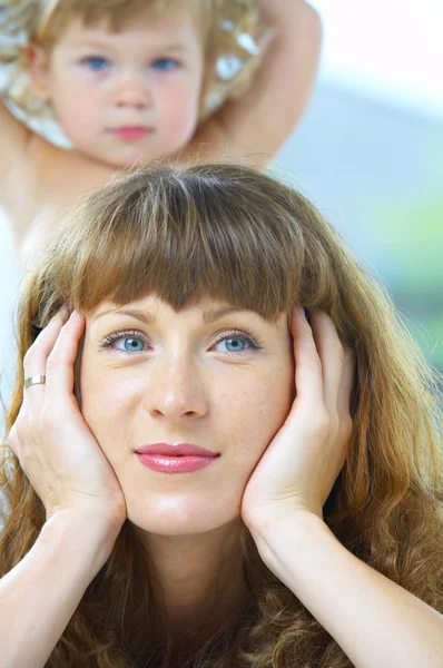 High key portrait of happy mother with baby — Stock Photo, Image