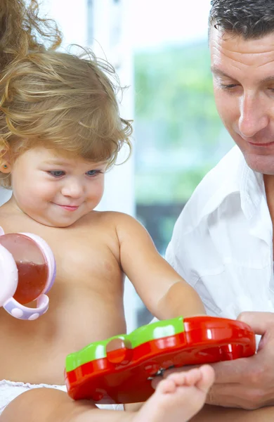 High key portrait of nice young family getting busy — Stock Photo, Image