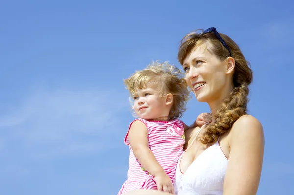 Portrait of young happy mother holding her baby — Stock Photo, Image