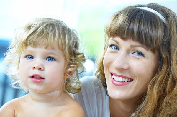 High key portrait of happy mother with baby — Stock Photo, Image