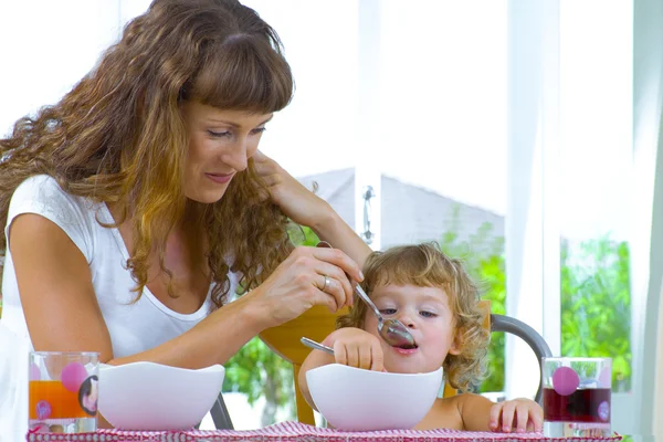 High key portrait of happy mother with baby — Stock Photo, Image