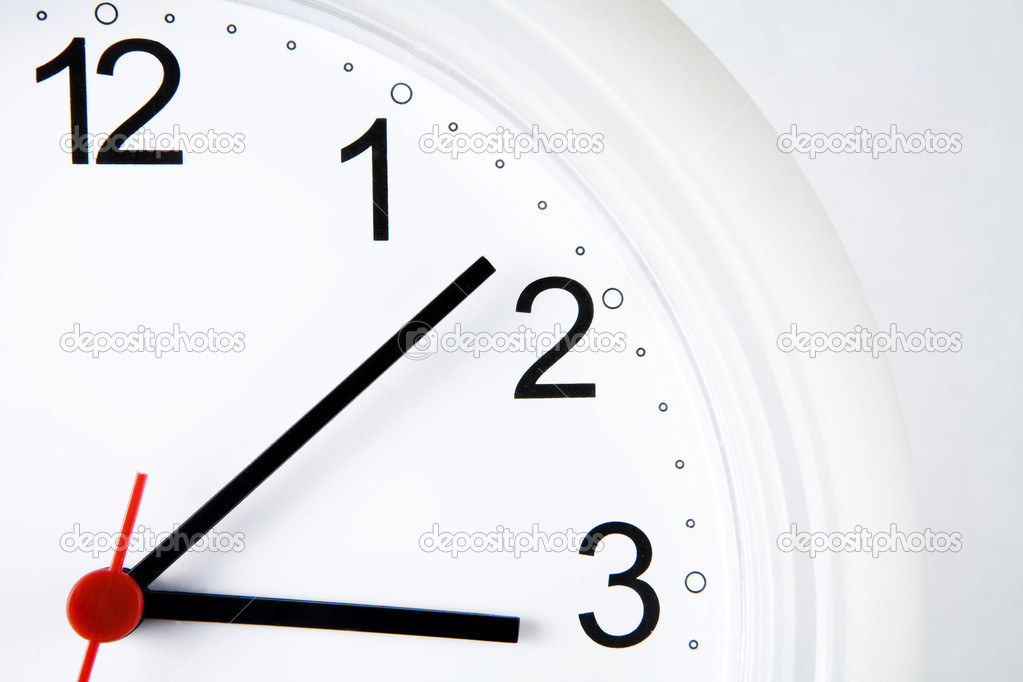 Close up view of big wall clock on white back