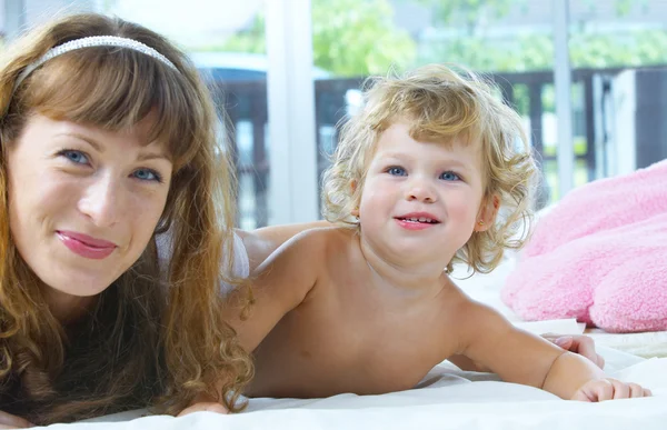 High key portrait of happy mother with baby — Stock Photo, Image