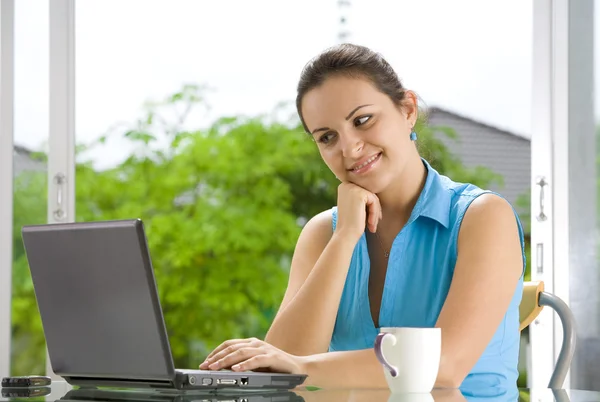 Portrait of young beautiful woman with her laptop Stock Image