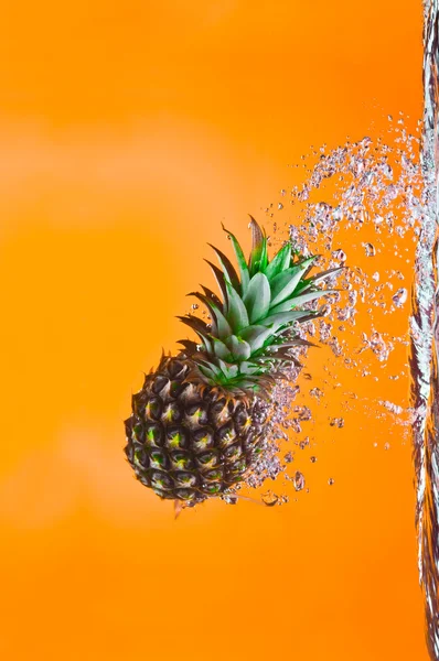 View of nice big pineapple getting through the water — Stock Photo, Image