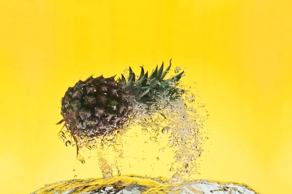View of nice big pineapple getting through the water — Stock Photo, Image