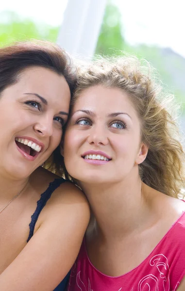 Portrait of two young attractive girls having good time — Stock Photo, Image