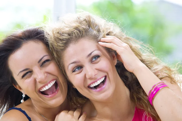 Portrait of two young attractive girls having good time — Stock Photo, Image