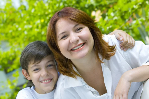 Portrait of a young boy with his mother in summer environment Royalty Free Stock Photos