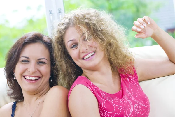 Portrait of two young attractive girls having good time — Stock Photo, Image