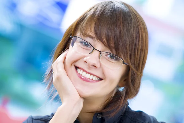 Portrait of young pretty woman in business environment — Stock Photo, Image