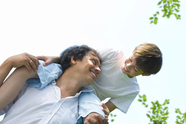 Portrait of young happy father getting busy with his son — Stock Photo, Image