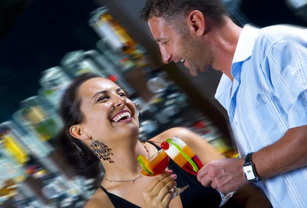 Portrait of young attractive couple having date in bar — Stock Photo, Image