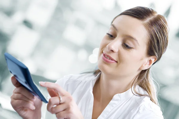 Portrait of young pretty women discussing project in office environment — Stock Photo, Image