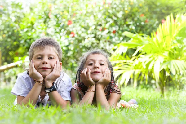 Portrait of little kids having good time in summer environment Stock Image