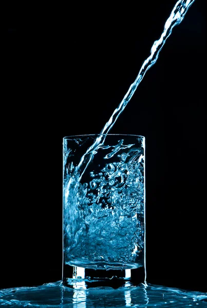 View of nice glass getting filled with water — Stock Photo, Image