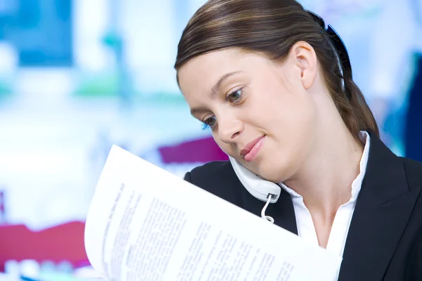 Portrait of young pretty woman in business environment — Stock Photo, Image