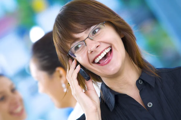 Portrait of young pretty woman in business environment — Stock Photo, Image