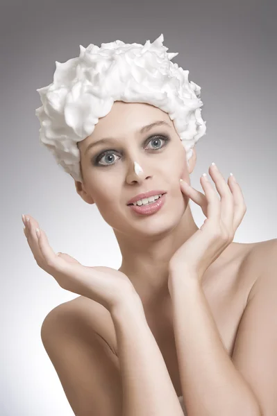 High key portrait of young woman on gray back — Stock Photo, Image