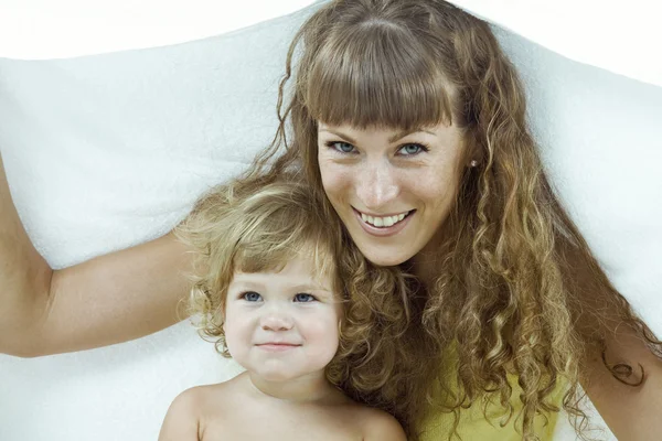 High key portrait of happy mother with baby — Stock Photo, Image