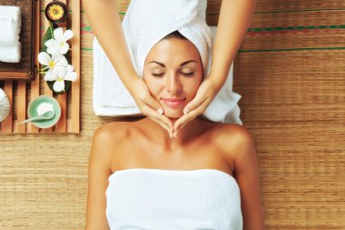 Portrait of young beautiful woman in spa environment clipart