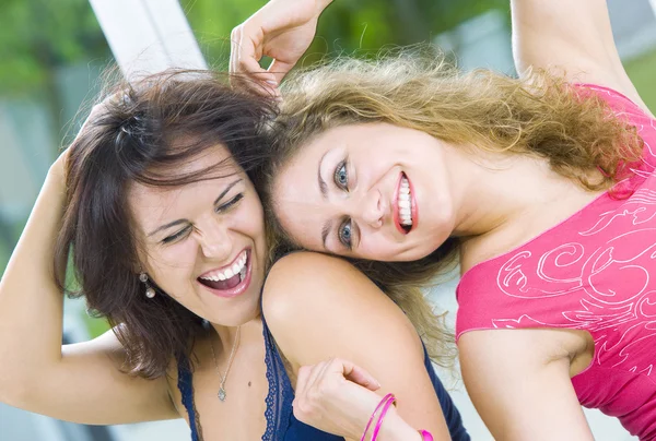 Portrait of two young attractive girls having good time — Stock Photo, Image