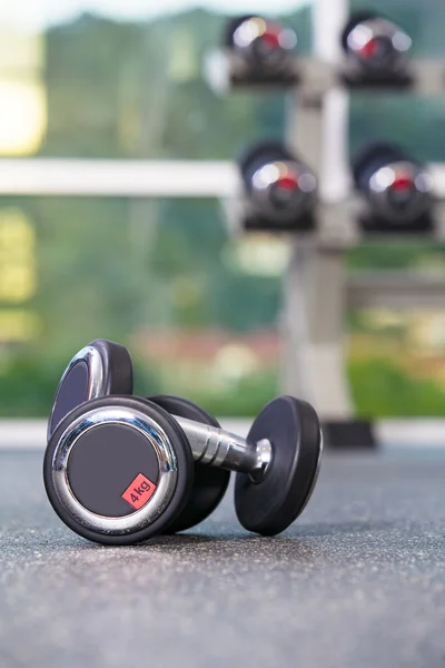 Fragment like view of gym interior with some dumbbells — Stock Photo, Image