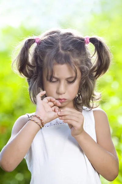 Portrait of little girl having good time in summer environment — Stock Photo, Image