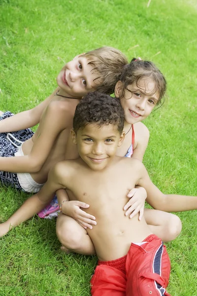 Portrait of little kids having good time in summer environment Royalty Free Stock Photos