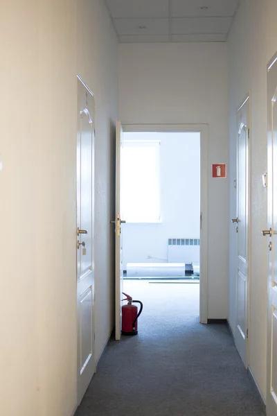 Doors propped extinguisher — Stock Photo, Image