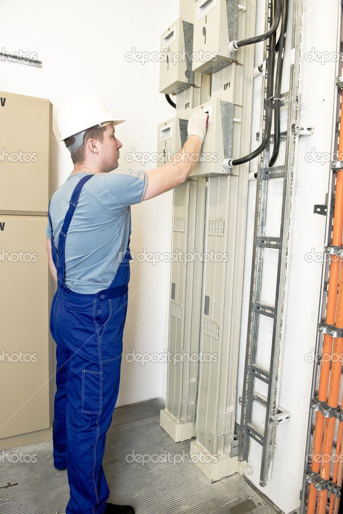 electrician holding the power switch