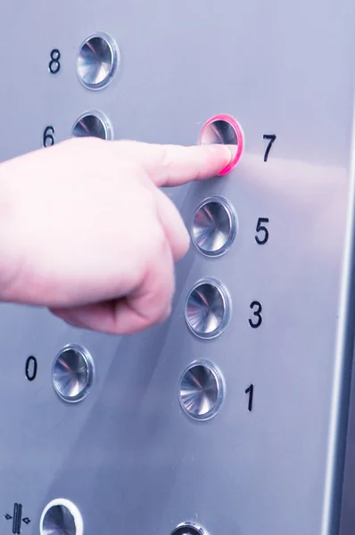 Man pushing buttons on an elevator — Stock Photo, Image