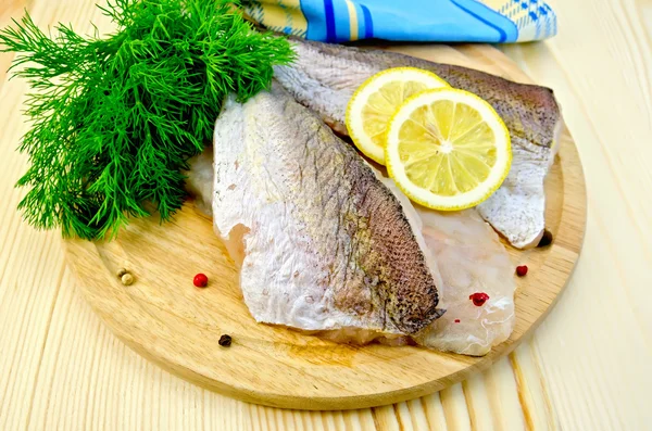 Fillet of codfish on board with napkin — Stock Photo, Image