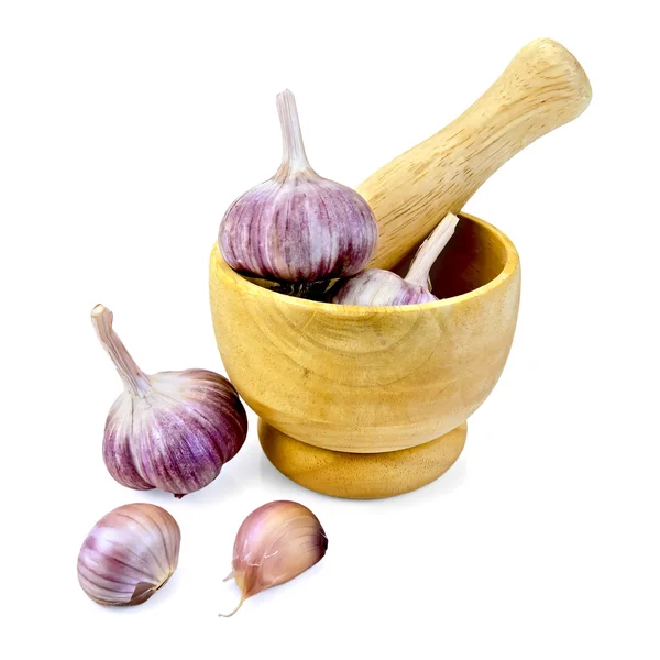 Garlic in a wooden mortar — Stock Photo, Image