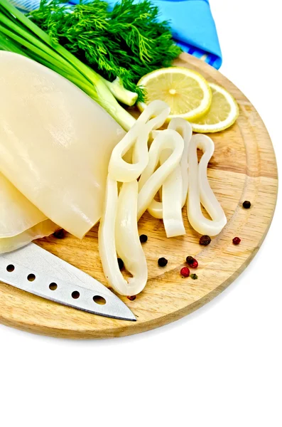 Squid with lemon and knife on a round board — Stock Photo, Image